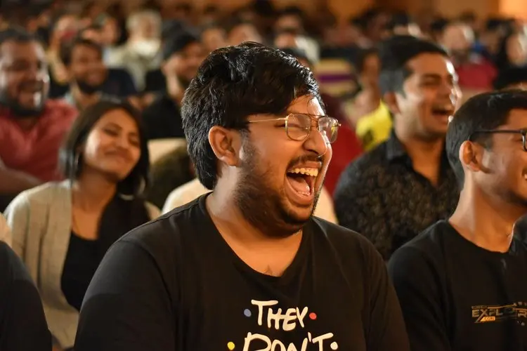 Audience laughing during corporate magician Josh Weidner's comedy magic show